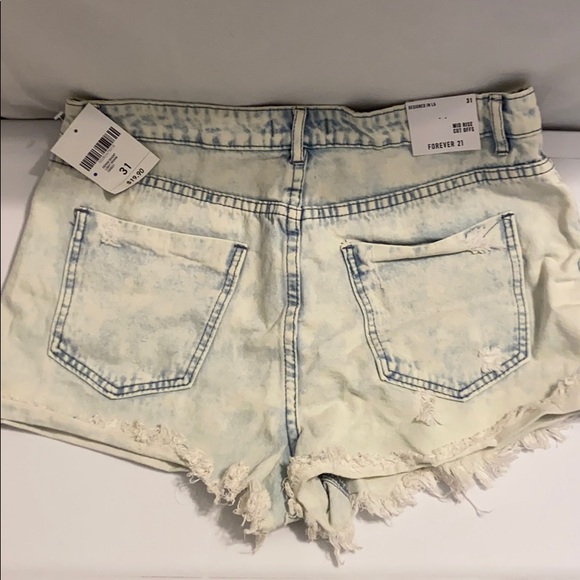 Light Denim Distressed Mid Rise Jean shorts - Picture 5 of 6